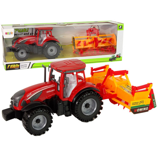Punainen traktori oranssilla kultivaattorikäytöllä